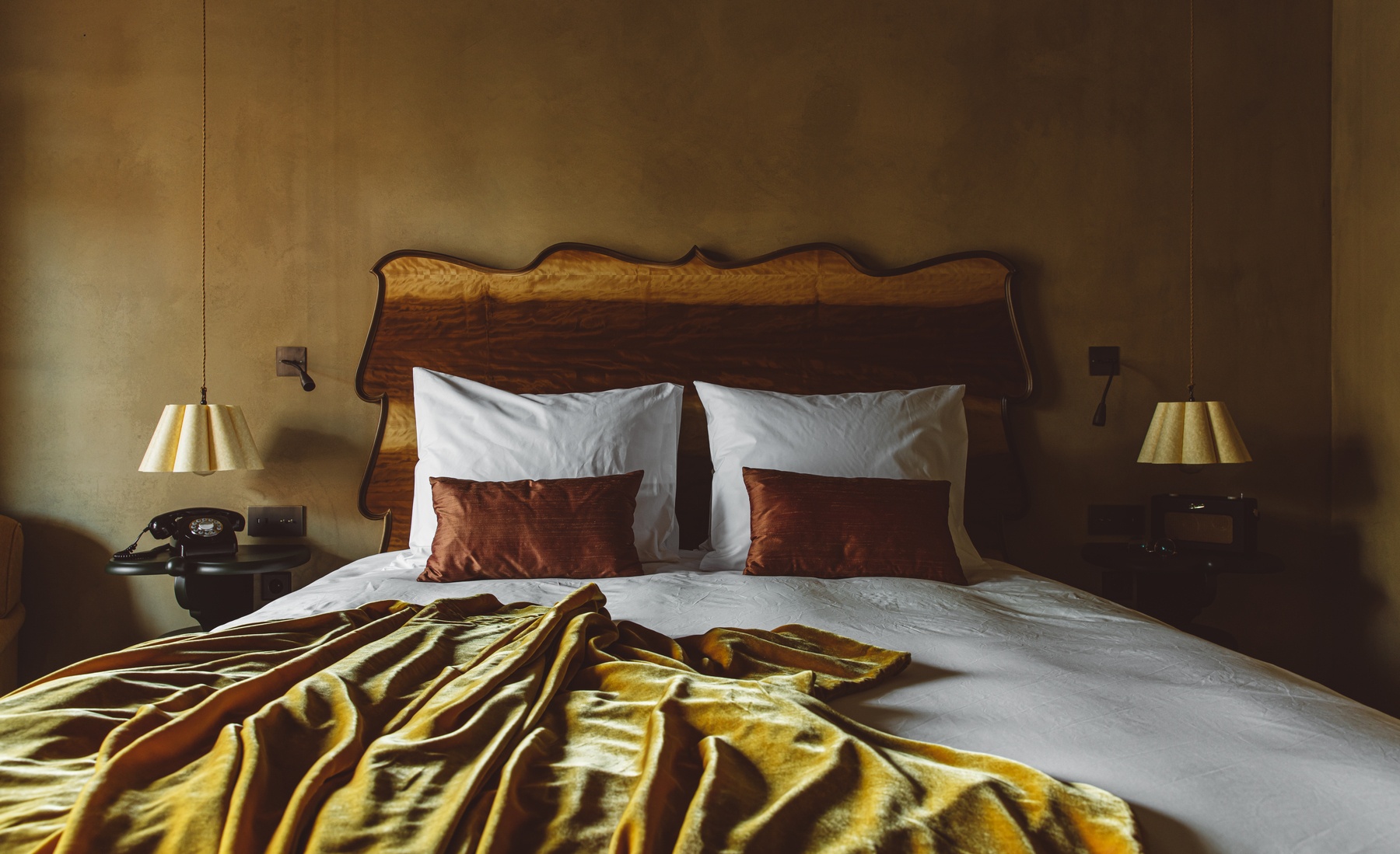 Bed in room at boutique hotel De Durgerdam