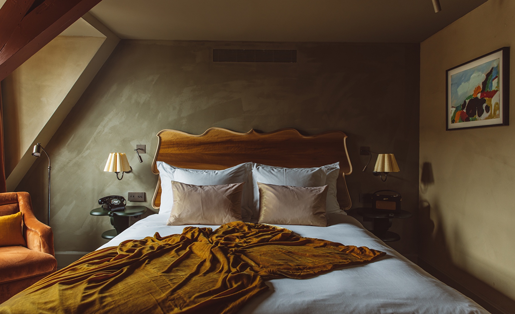 Bed in room at boutique hotel De Durgerdam